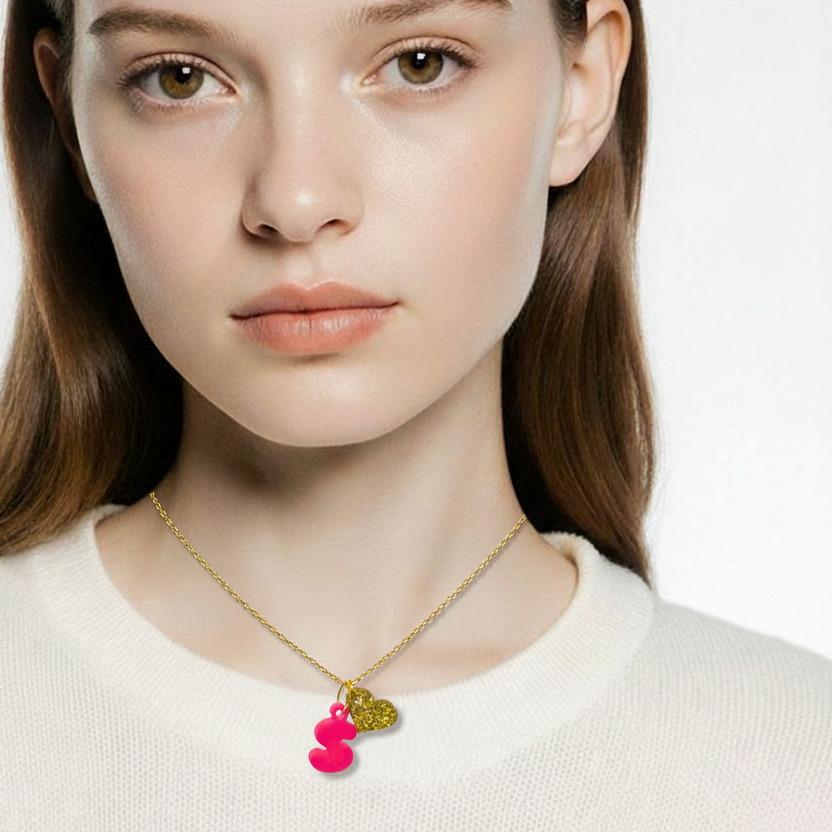Woman wearing a gold necklace with colorful pendants on a white background
