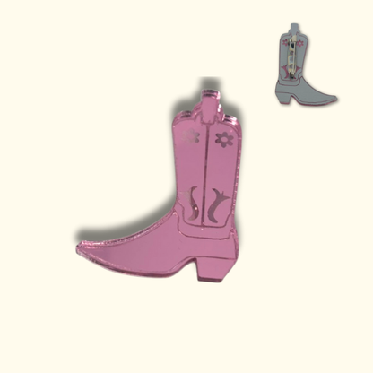 Pink mirror cowboy boot-shaped pin on a white background